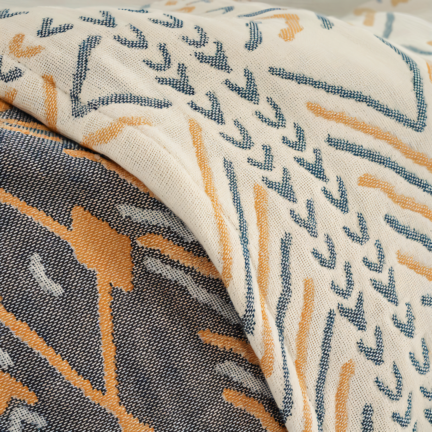 Reversible cotton sofa blanket with twill fleece