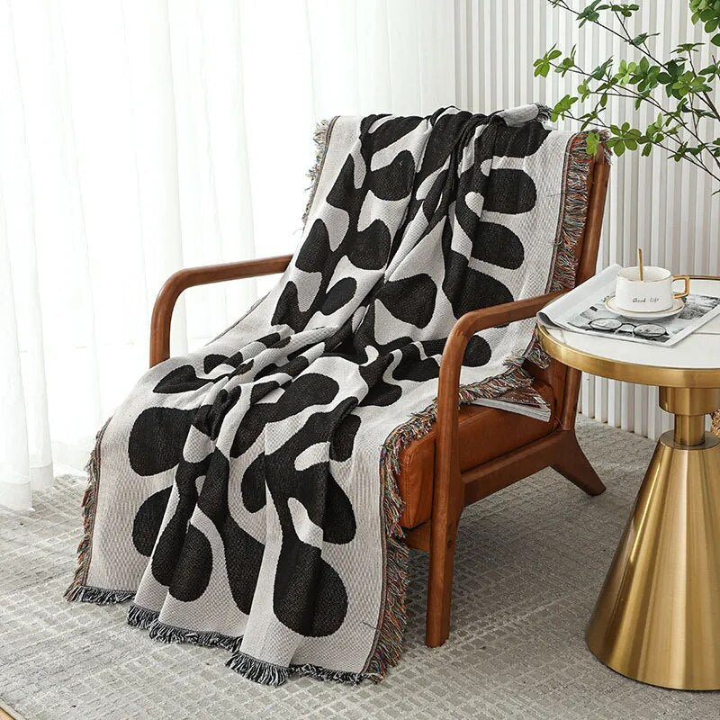 Retro knitted blanket in a vine design