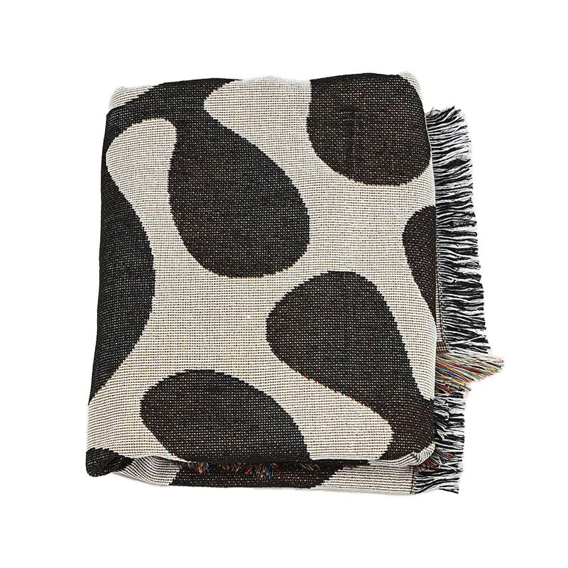 Retro knitted blanket in a vine design