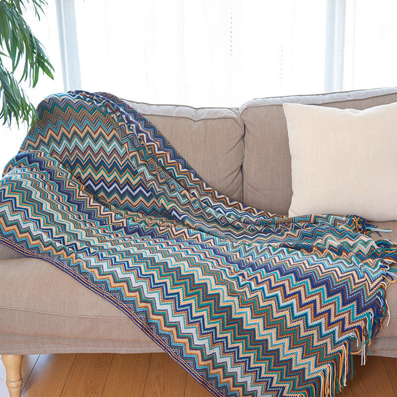 Colorful striped throw blanket with tassels