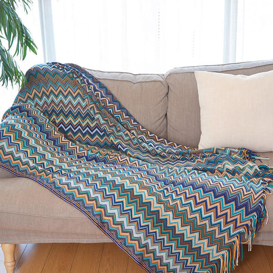 Multicolored striped blanket with tassels