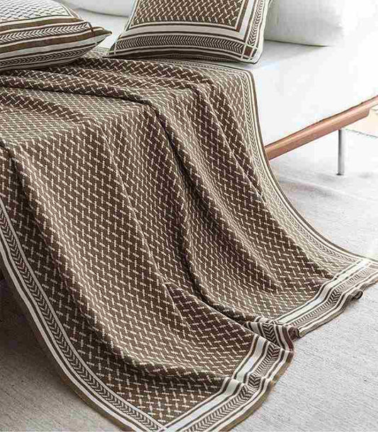 Versatile reversible knitted blanket