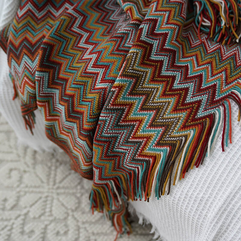 Colorful striped throw blanket with tassels