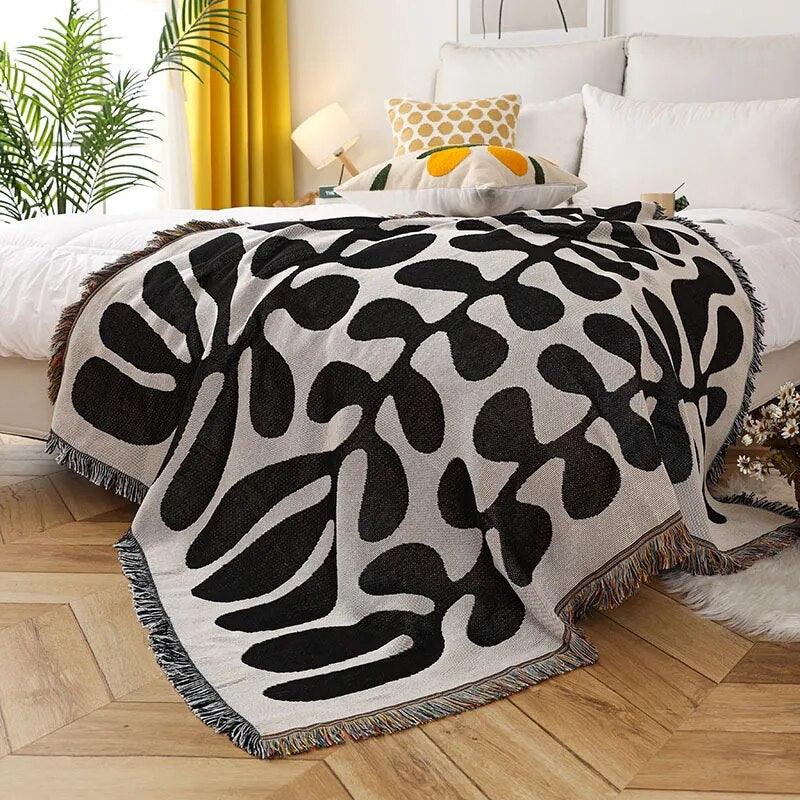 Retro knitted blanket in a vine design
