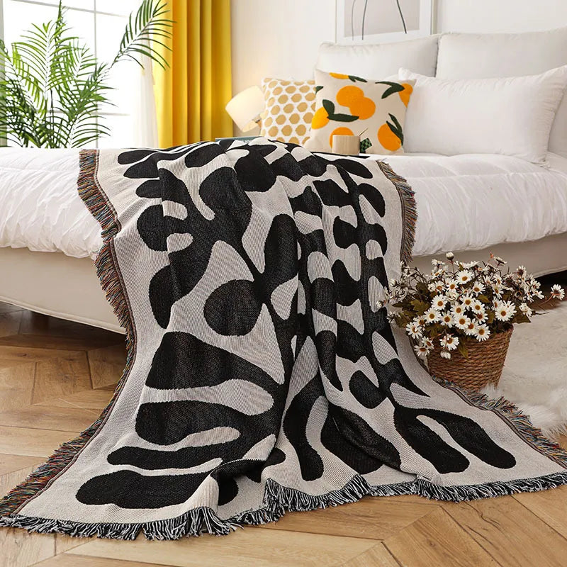 Retro knitted blanket in a vine design