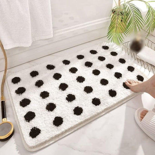 https://cdn.shopify.com/s/files/1/0637/4480/2863/files/TuftedPlushPolkaDotBathMat_2.jpg?v=1748328842