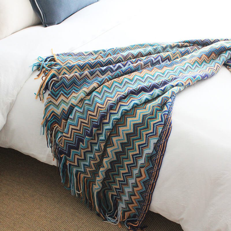 Colorful striped throw blanket with tassels