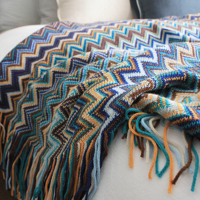 Colorful striped throw blanket with tassels