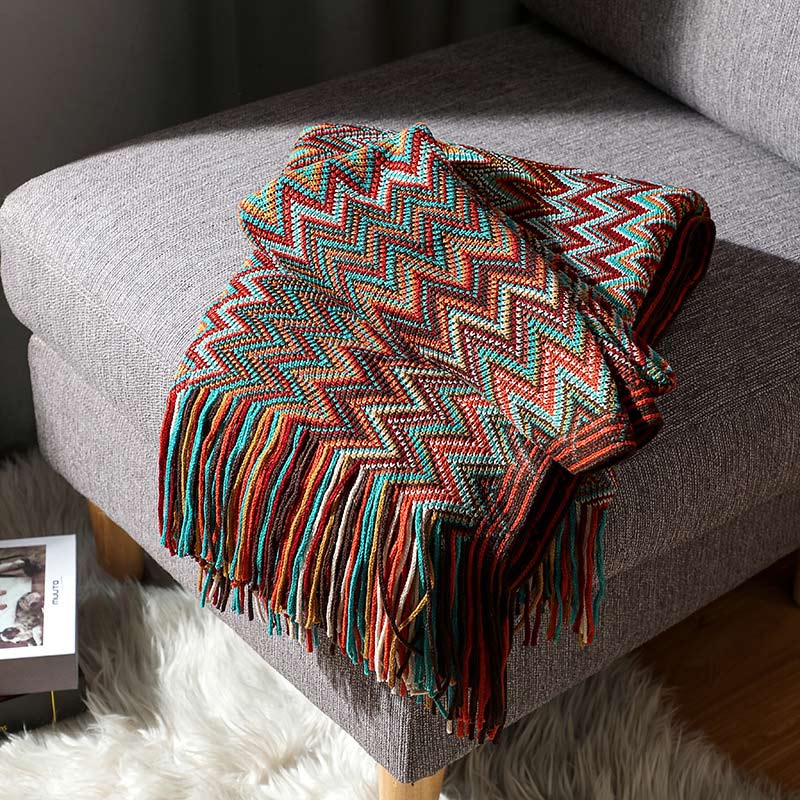 Colorful striped throw blanket with tassels